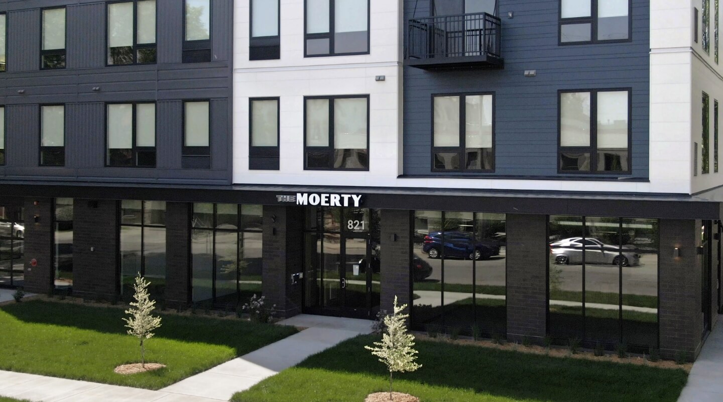 The facade of The Moerty building with clear signage.